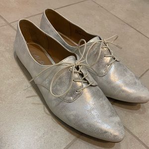 Metallic silver and white loafers